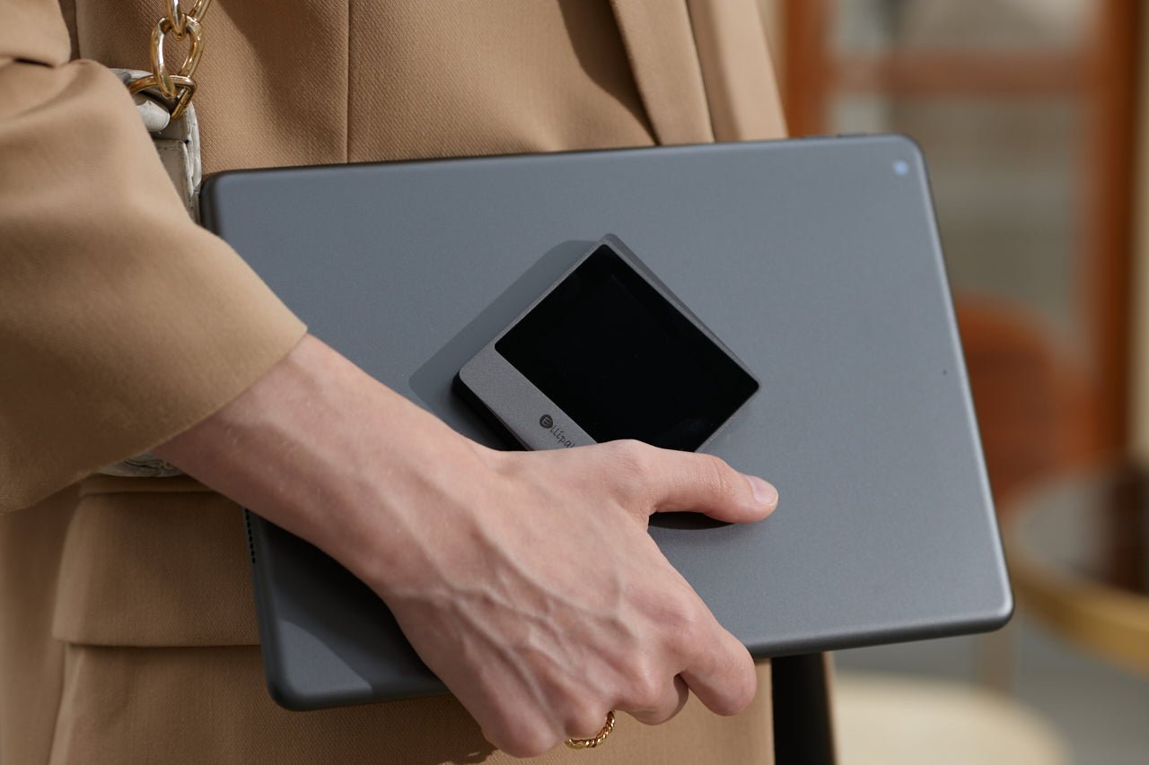 ELLIPAL Titan Mini DUO held with a tablet, crypto hardware wallet #product_nELLIPAL Titan Mini DUOame# - ELLIPAL