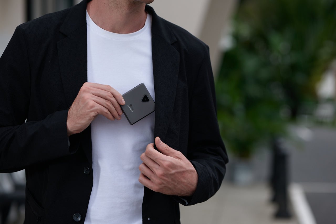 Man with ELLIPAL Titan Mini DUO crypto wallet, protecting bitcoin