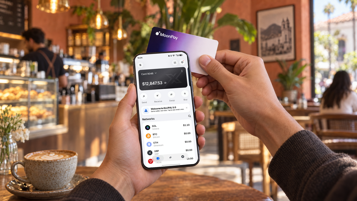 Person using a smartphone at a cafe with the ELLIPAL X Card MoonPay Edition NFC cold wallet.